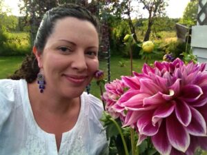 Jessica with a purple dahlia flower